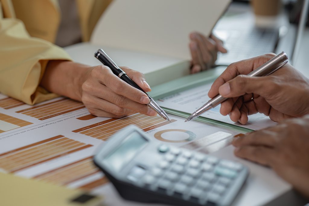 Two professionals working on a document