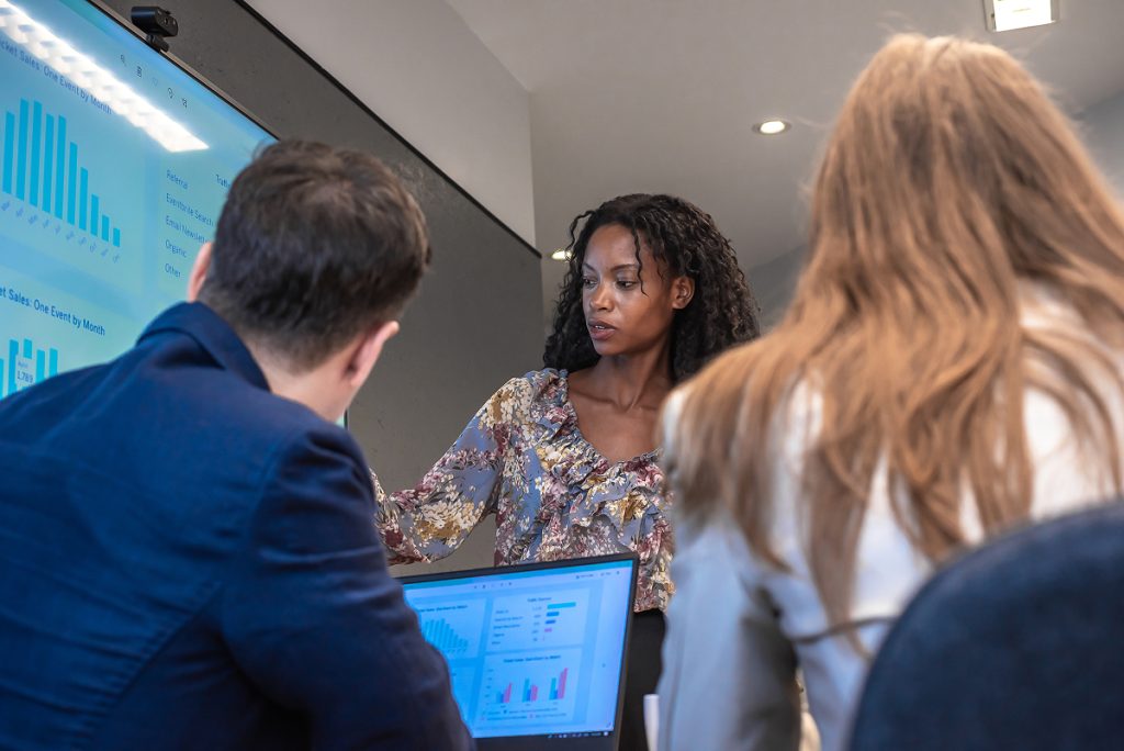 A team of accountants analysing numbers and graphs