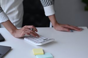 A female accountant using a calculator