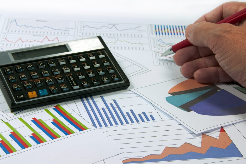 An accountant looking over graphs