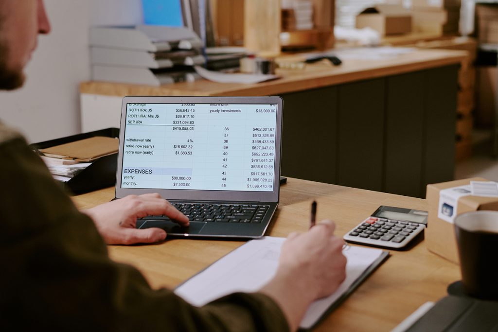 A male accountant analysing some payroll records